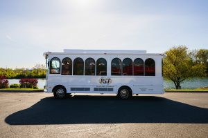 a white bus parked in a parking lot