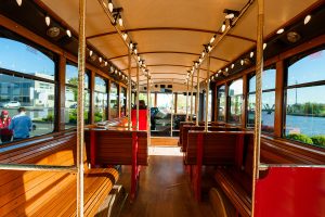 A bus with benches overlooking the water - PST Trolley