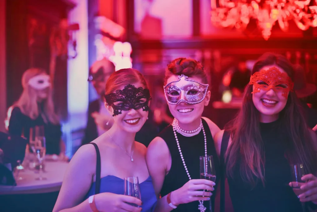 a group of women standing next to each other in a bachelorette party
